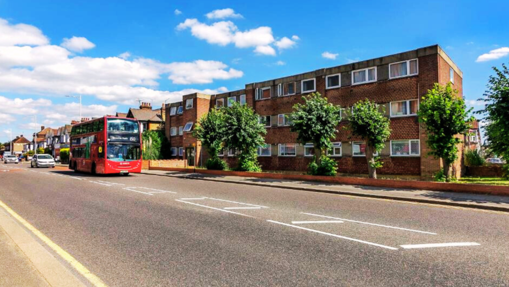 Modern apartment complex in Gants Hill, East London, with large windows, balconies, and a landscaped entrance.