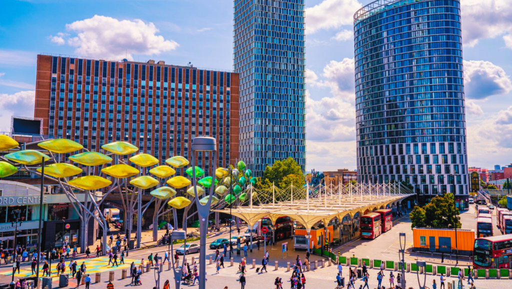 Modern high-rise apartments in Stratford, London, with sleek architecture and landscaped surroundings.