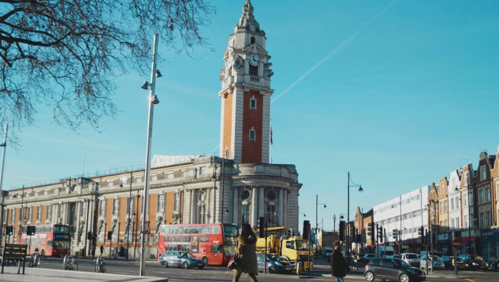 A vibrant street in Brixton, South London, with shops and people, highlighting rental opportunities for landlords and tenants.