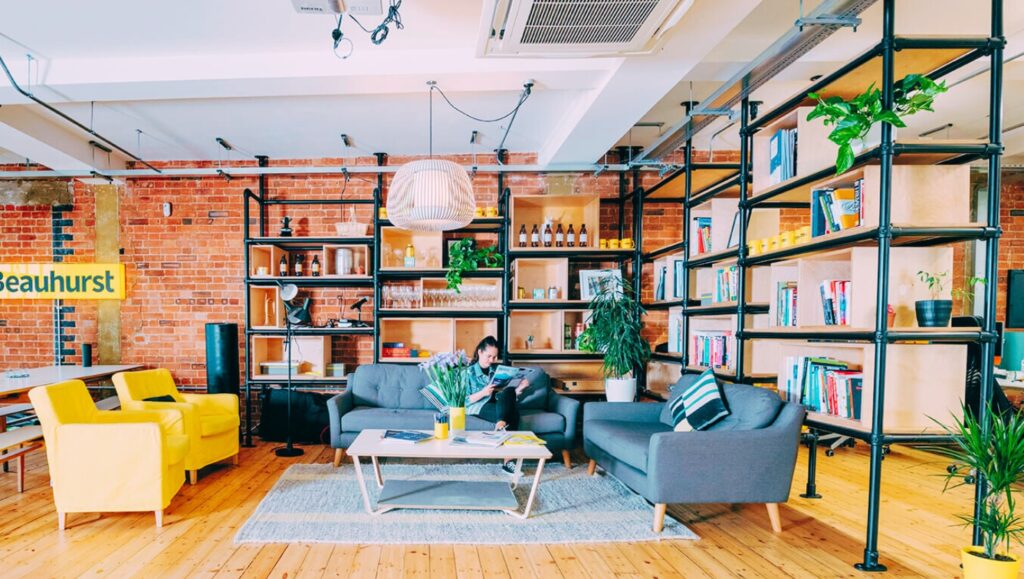 A modern co-working space in Brixton with young professionals working.