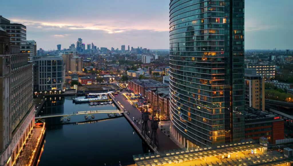 Interior of a luxury apartment in Canary Wharf with floor-to-ceiling windows.